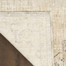 Runner rug corner detail with border stitching and light ivory ground with gray pattern