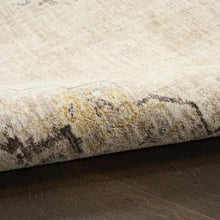 Runner rug detail showing soft pile and distressed design in light gray and warm ivory