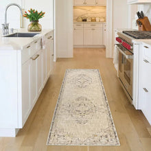 Antiqua runner rug with distressed geometric medallion pattern in light gray and ivory
