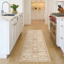 Runner rug with beige base and distressed rust, green, and gray pattern