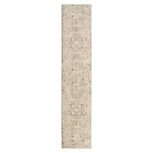 Runner rug with beige surface and distressed medallion design, subtle rose details