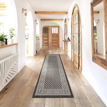Indoor/outdoor rug runner with black and white geometric diamond pattern, rectangular.