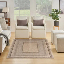 Indoor/outdoor rug laid flat with beige center square and taupe border