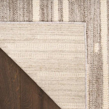 Runner rug corner showing flat woven edge and neutral striped texture