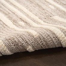 Short-pile runner rug with textured loop surface and light beige/gray vertical pattern