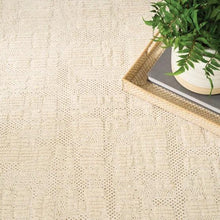 Cream runner rug with woven texture and visible pattern near a narrow border edge