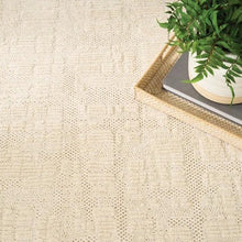 Ivory runner rug with subtle square texture and bordered edge