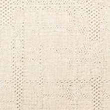 Ivory textured rug panel with repeating raised loop pattern