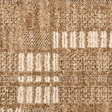 Close-up of looped texture on tan runner rug with white geometric lines