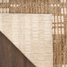 Runner rug corner with cream woven face and brown backing fold
