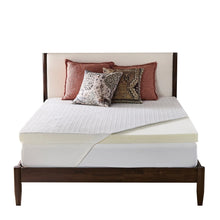 Back support mattress topper on bed, white quilted top and cream side panel