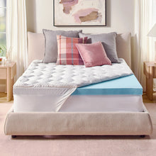 Blue gel memory foam mattress topper visible on a white bed with pillows