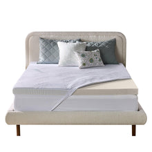 Gel memory foam mattress topper with white cover on a bed