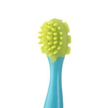 Nuby massage tool head with yellow-green textured bristles on blue handle
