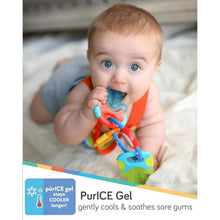 Baby teether with blue, orange, and teal keys held near mouth by an infant