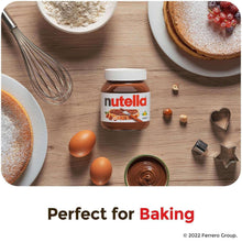 Hazelnut cocoa spread jar with eggs, baking pans, and powdered pastries