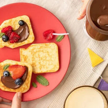 Nutella hazelnut cocoa spread jar with creamy spoonful above toast