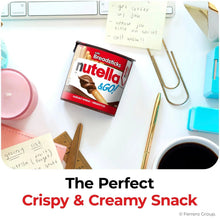 Nutella & GO! hazelnut spread cup with breadsticks on a desk with school supplies nearby