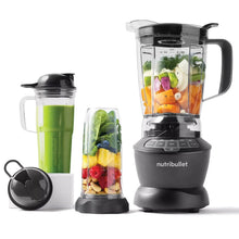 Gray countertop blender with clear pitcher and single-serve cup set