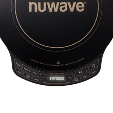 Close-up of black induction cooktop control panel with time and heat settings