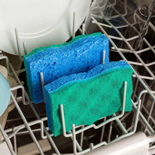 Green-and-blue scrunge sponges in dishwasher rack