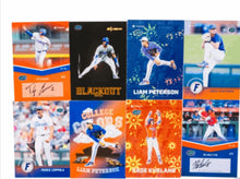Baseball trading card set with multiple player cards in blue and orange