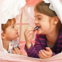 Parent and child sharing an OREO sandwich cookie while eating