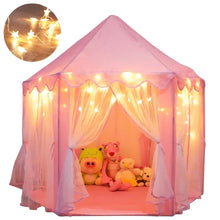 Pink princess castle play tent with sheer curtains and warm LED star lights across the doorway.