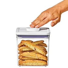 OXO POP container holding bread slices with lid being closed by hand