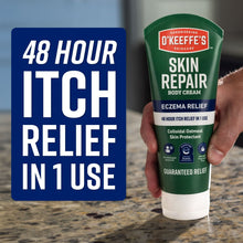 O’Keeffe’s Skin Repair body cream tube held in hand, green eczema relief label