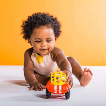 Orange-red infant crawling push rattle car with yellow dome and colorful wheel beads