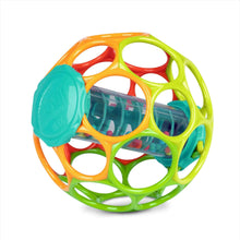 Colorful grippy rattle ball with clear central cylinder and rainbow ring frame