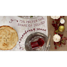 Jellied cranberry sauce molded slices in tray with serving utensil