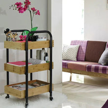 3-tier storage cart with black metal frame and light wood shelves on casters