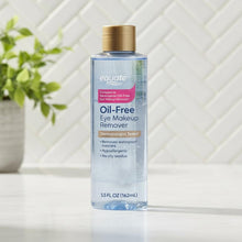 Oil-free eye makeup remover bottle with gold cap and blue printed label.