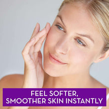 Woman gently applying facial cleanser near her cheek