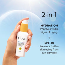 Hand holding Olay Complete SPF 30 lightweight lotion bottle, 2-in-1 hydration