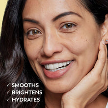 Smiling woman with hands at face, smooth bright skin-care look