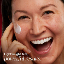 Woman with white moisturizer patches on cheek and under-eye, lightweight face cream