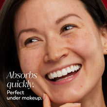 Smiling woman with face moisturizer on cheek and chin, niacinamide