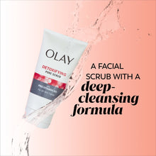 Olay Detoxifying Pore Scrub face wash tube with water splash beside it