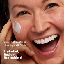 Person applying Olay Active Hydrating lotion to cheek with visible cream swipe