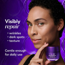 Olay Regenerist Retinol 24 night repairing cream jar near face, purple glass container.