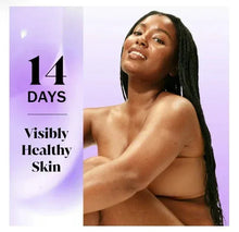 Woman applying body care on bare shoulders, long hair, smiling