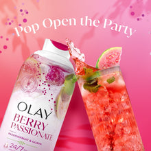 Olay Berry Passionate body wash bottle with fruit splash beside it