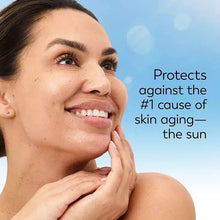 Olay Complete+ SPF 40 moisturizer applied to face with bottle beside cheek