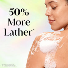 Woman with body wash foam on her skin; 50% more lather promotional ad.