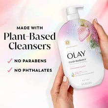 Olay Fresh Radiance body wash bottle held in hand with plant-based cleansers text