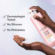 Body wash bottle held in hands; labels include dermatologist tested and no silicones