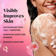 Foaming body wash lather on skin with strawberry-themed bubbles
